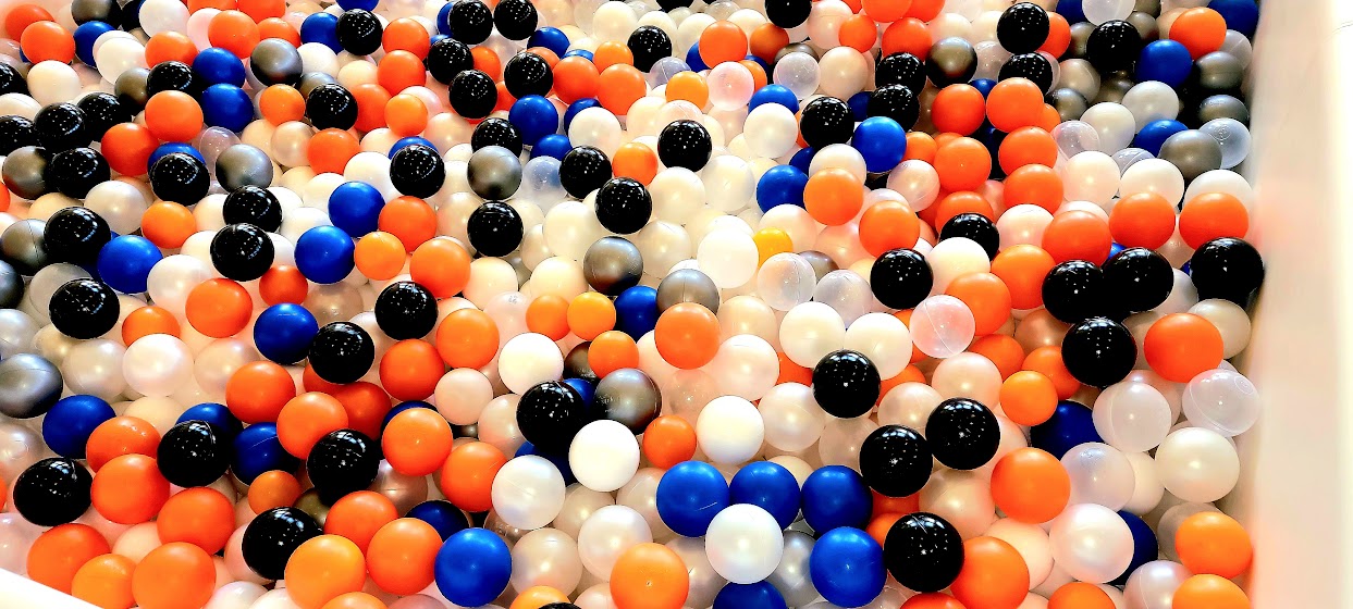 orange, black, white, and blue ball pit balls